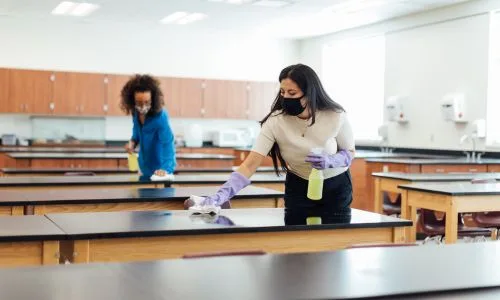 Team of cleaners disinfecting office space in Toronto.
